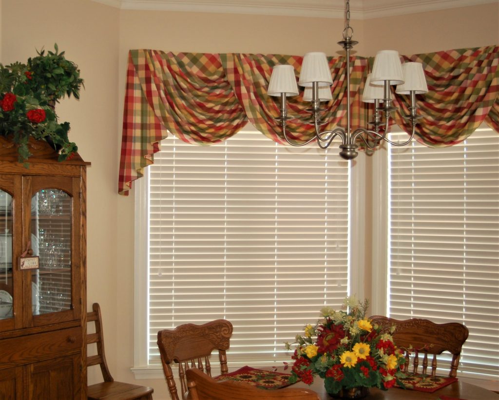 custom window valance, board mounted swags and jabots on a bay window