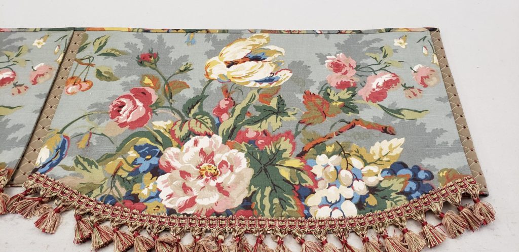 The lower edges of this custom Hidden Rod Pocket valance are still finished with micro-cording even though they also have trim.